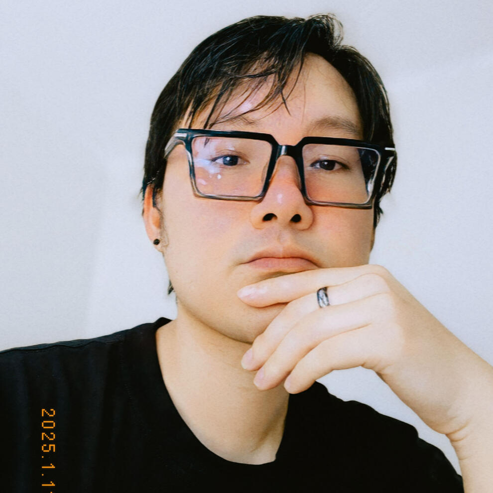 Pensive portrait of Kenz Tran, founder of MOCHIMIN, driving forward AI-powered tools like Lazy Prompter to transform marketing in Vietnam.